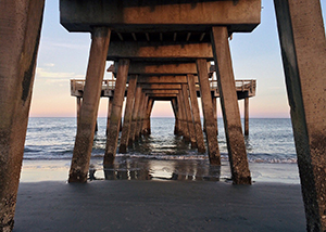 Presuppositions of Faith (5 of 6): The Problem of Evil - underneath pier pylons looking out to open ocean